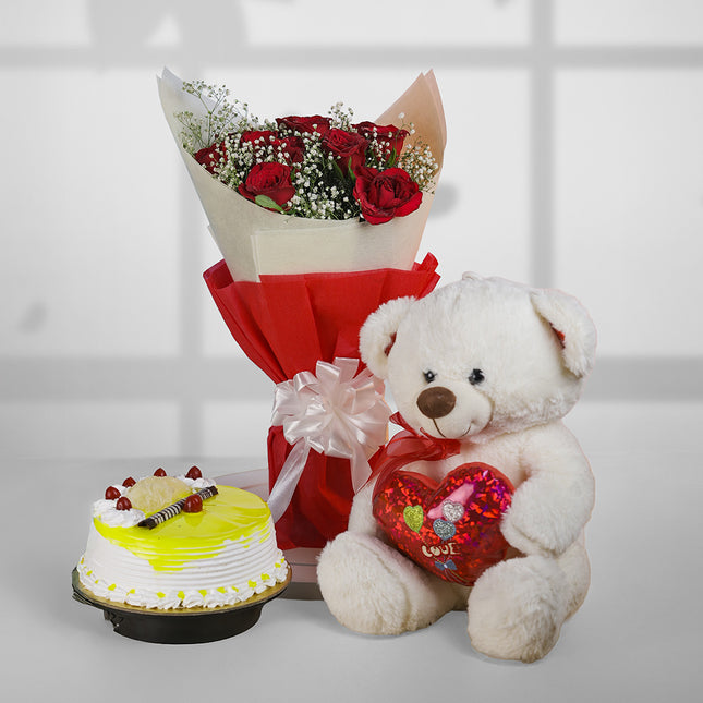 Red rose bouquet, white teddy bear with heart, and pineapple cake gift combo