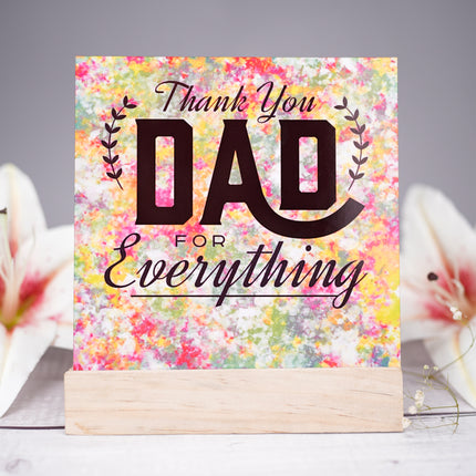 Thank you Dad card with colorful watercolor background, wooden stand, and white lilies