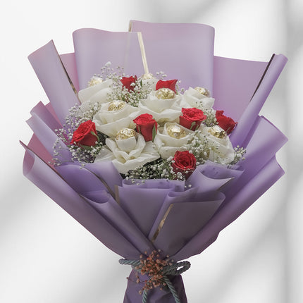 Ferrero Rocher chocolate bouquet with red roses, baby's breath, and purple wrapping